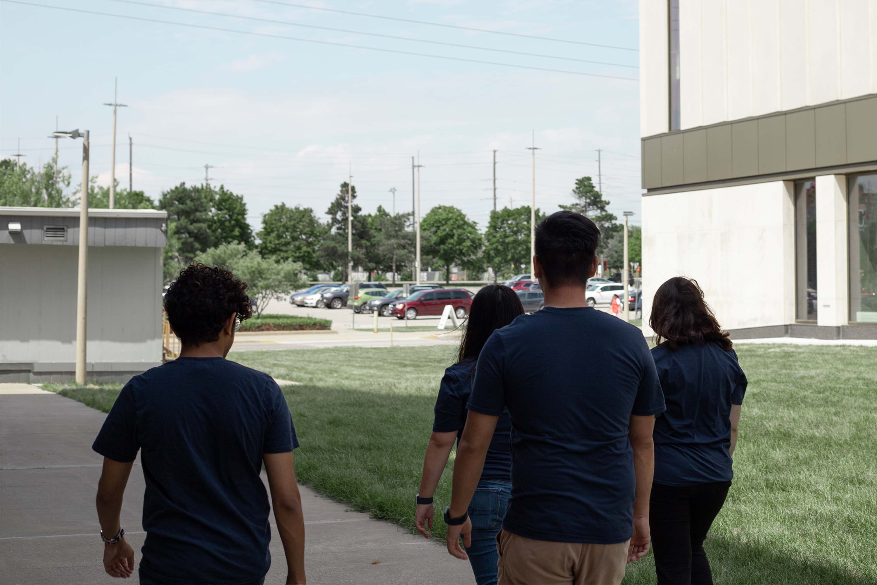 OTSU executives with their backs towards the camera, looking into the distance.