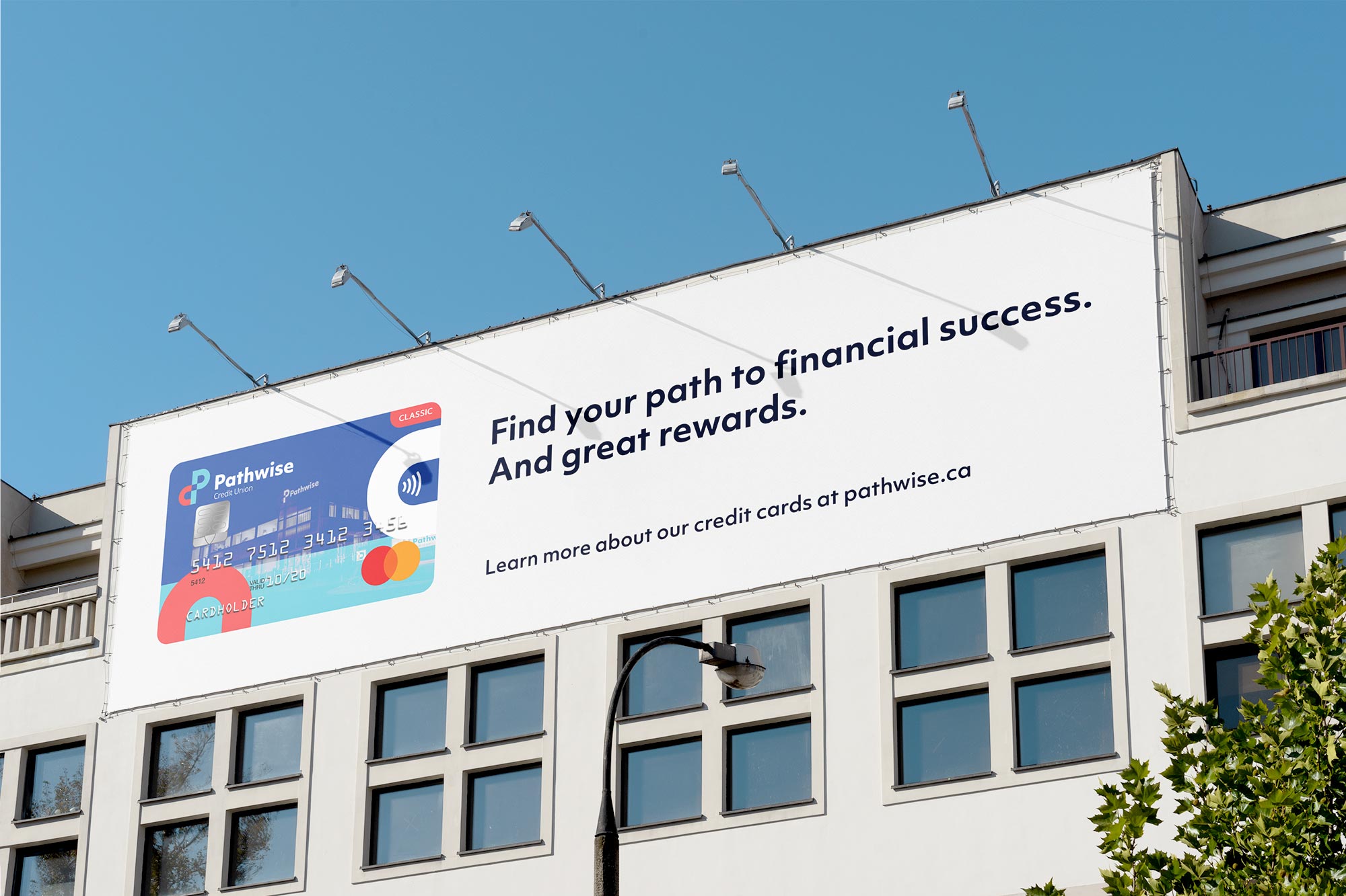 A billboard ad on a building. The ad is promoting their credit cards.